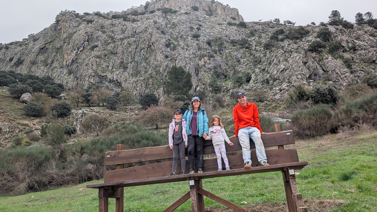 Family on the giant bench next to the Fuente de los 100 caños